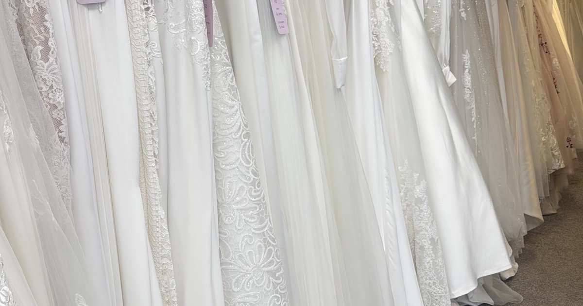 Rail of sample wedding dresses at Isobel's Bridal Outlet in Poole